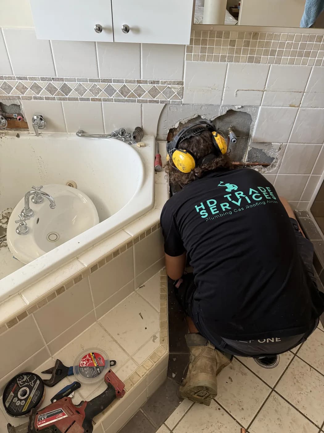 Drain machine, ear muffs on