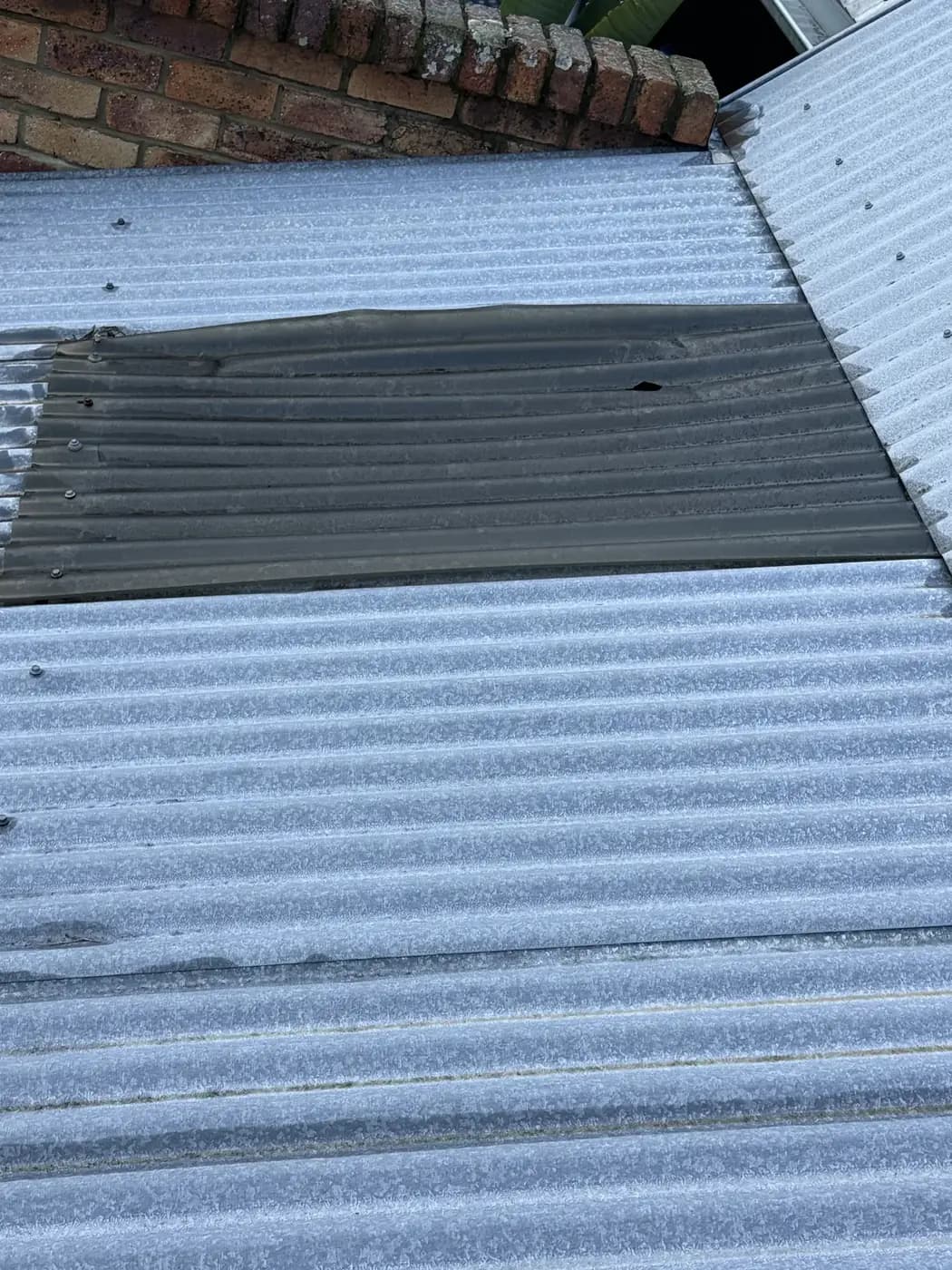 Rusted section re-sheeted before the ceiling paid for it - after